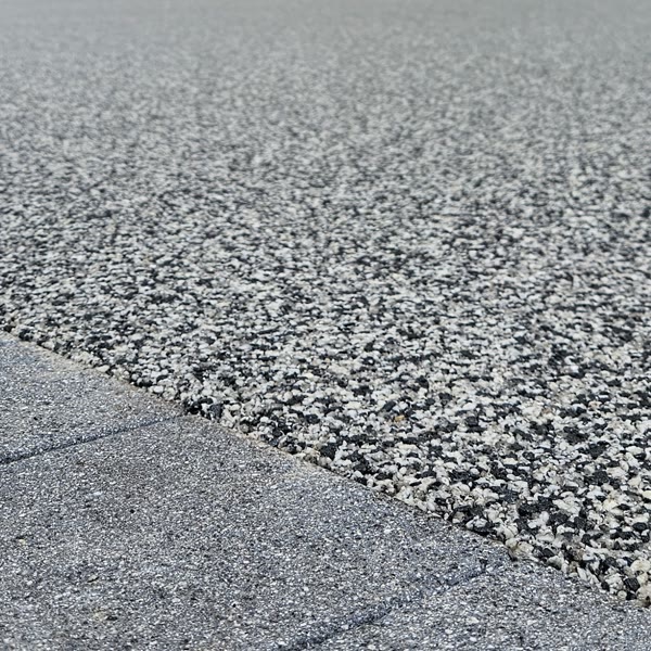 Washed, kiln-dried Moonshadow aggregate bound in UV-stable resin, shown up close